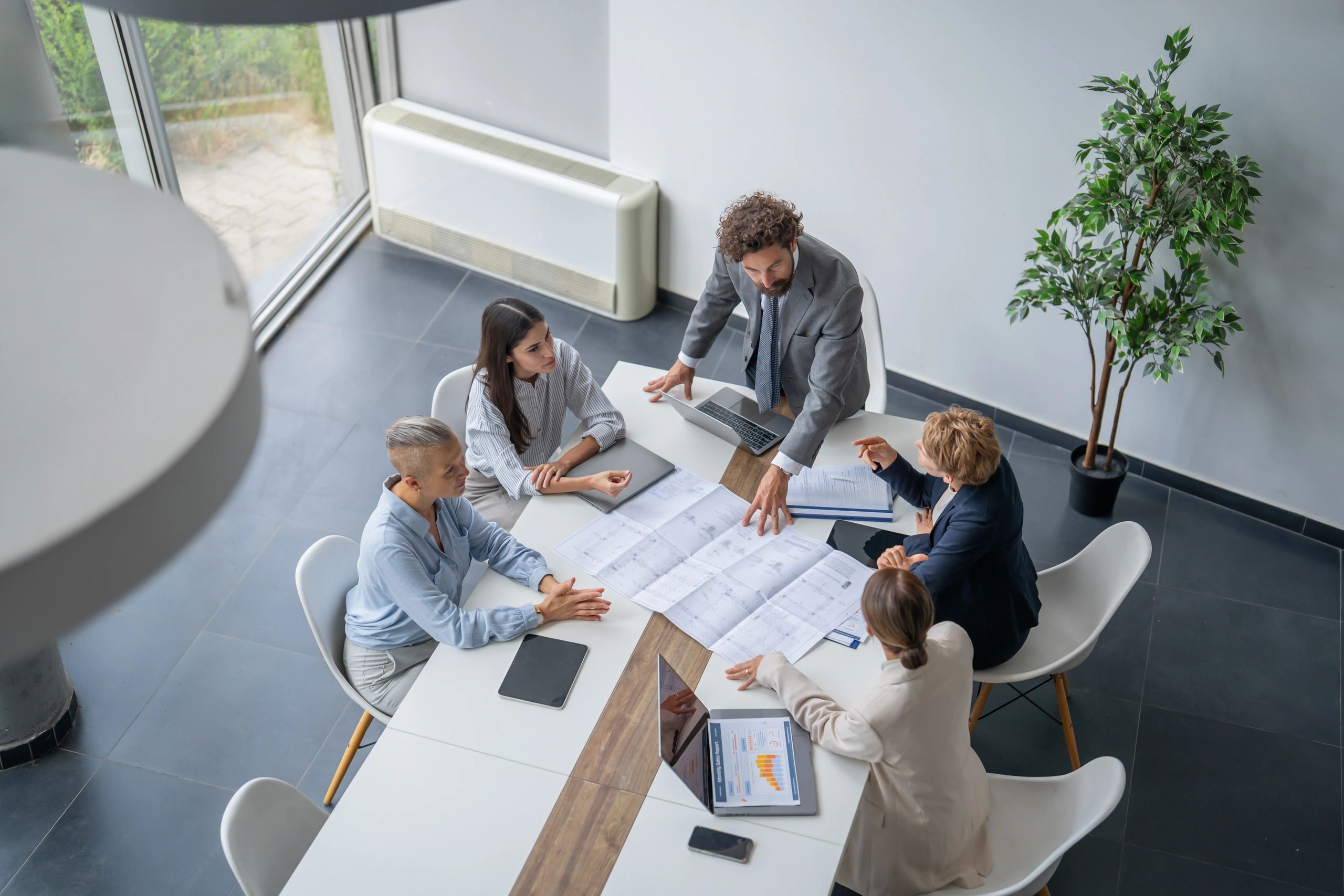 Professionals reviewing documents during a meeting